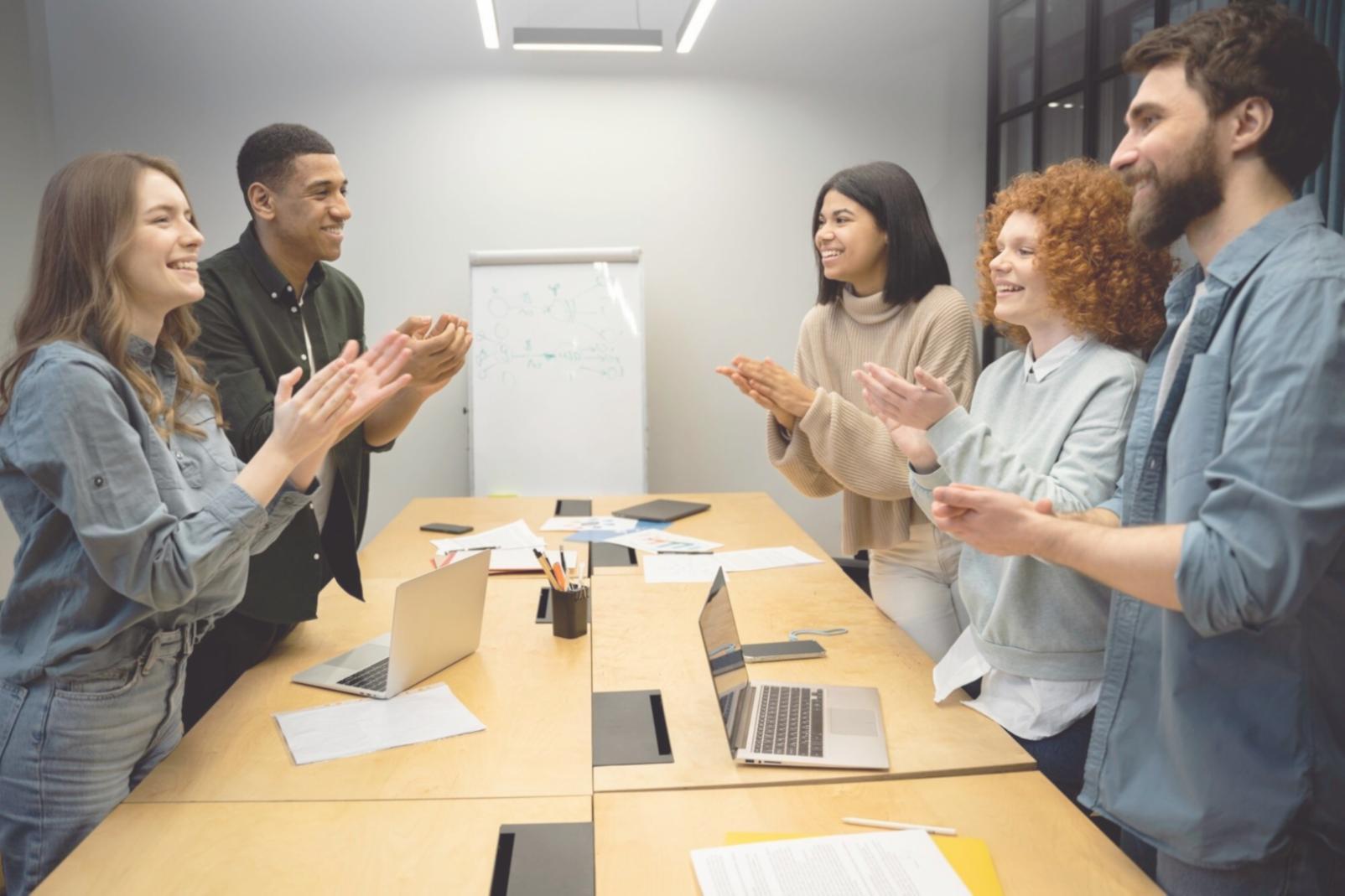 Students working collaboratively on financial planning exercises in modern classroom setting